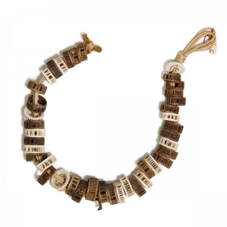Beads from the Channel Islands made from fish vertebrae, above, and steatite and clamshell beads,