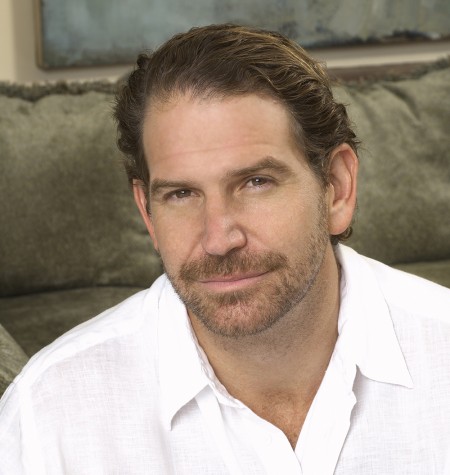 Head and shoulders portrait of Charles Annenberg Weingarten, wearing a white button down shirt